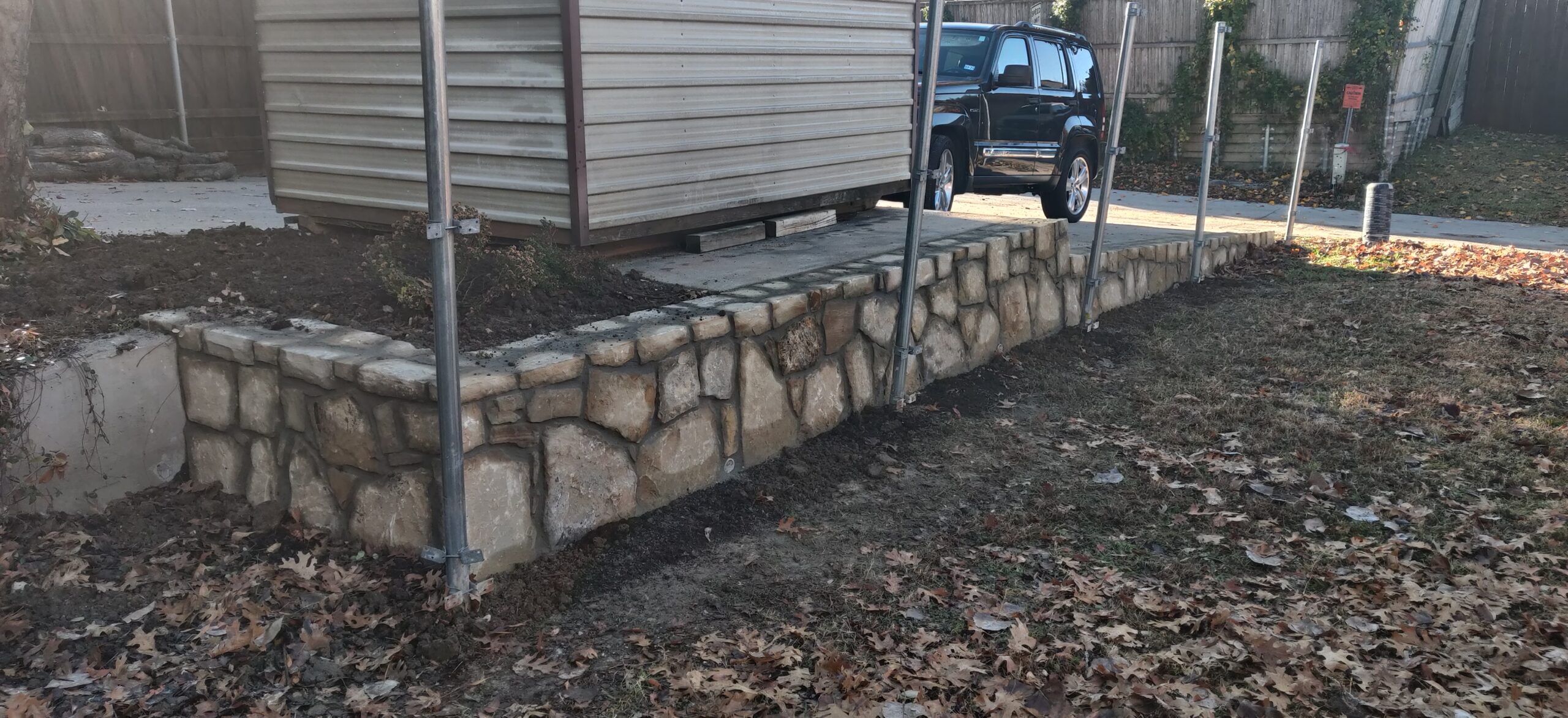 retaining-wall-bedford3 Replaced cross tie retaining wall with Milsap stone in Bedford